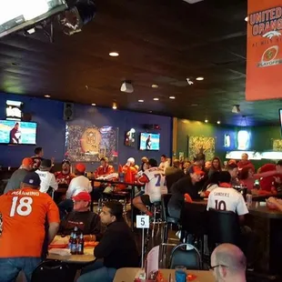 a large group of people sitting at tables
