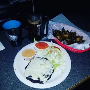 veggie burger with a spicy aioli and charred brussel sprouts! Not your typical bar food. Although their nachos are on point too!