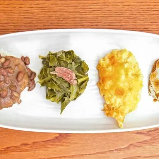 Quick look at some of our side starting from the left red beans and rice collard greens mac and cheese and some candied yams