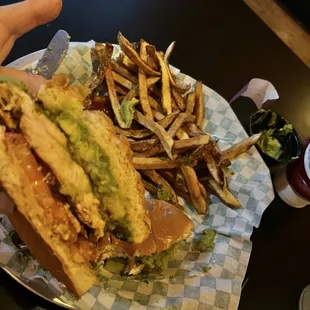 Grilled chicken avocado sandwich on brioche roll and great hand cut fries!