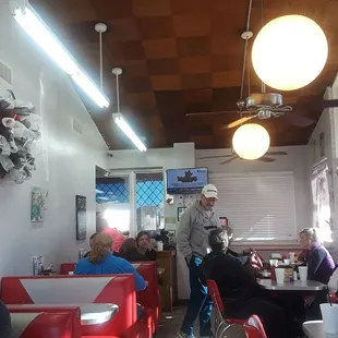a man standing in a diner