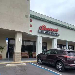  a car parked in front of the store