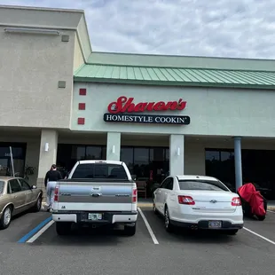  cars parked in front of the store