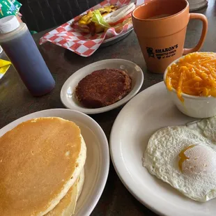 Corn beef breakfast with a side of pancakes