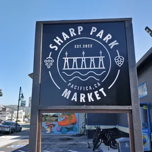 the sign for sharp park market