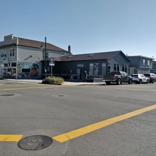 a parking lot with cars parked in front of it