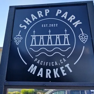 a sign for sharp park market