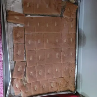 a baking pan full of pieces of bread