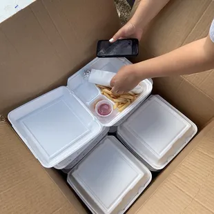 a person taking a picture of their meal