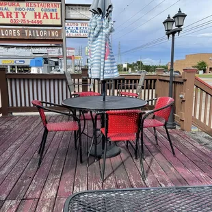 a table and chairs on a deck