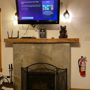 Our cute cabin's fireplace and roku TV(s) to watch our favorite shows