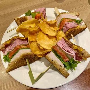 Indigo Club - Layers of turkey, ham, bacon w/ American &amp; Swiss cheeses on organic seeded multigrain bread