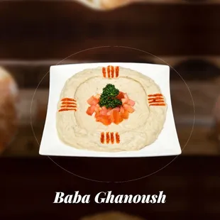 a plate of hummusle with salmon