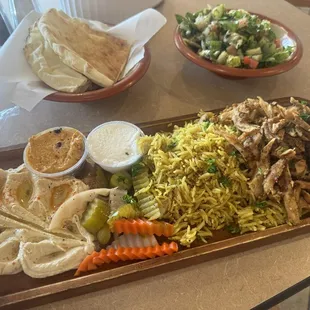 Shawarma chicken platter, comes with generous salad and pita bread.