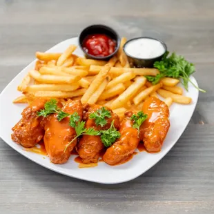 a plate of french fries and ketchup