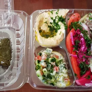 Falafel bowl and grape leaves.