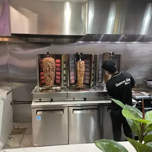 a man preparing food in a commercial kitchen