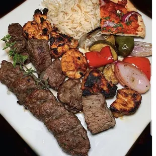 a plate of meat and rice