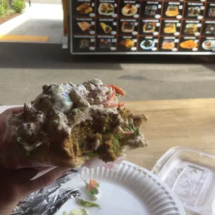 This is a delicious #4- The Big Falafel Gyro!  It was excellent!  Lots of sauce and fillings