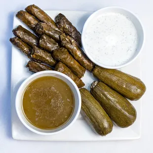 a plate of food with dipping sauce