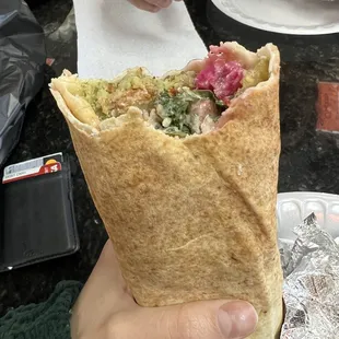 a hand holding a wrap