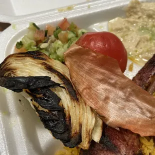 lamb chops comes with salad, rice, hummus, and burn veggies