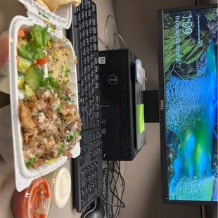 a desk with a computer and a keyboard