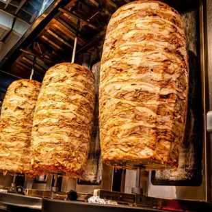 three kebabs being cooked