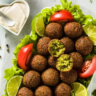 a platter of falaf and tomatoes
