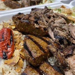 Beef kabab and beef shawarma with caesar salad and almond rice