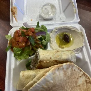 Gyro wrap meal with pita bread hummus &amp; salad