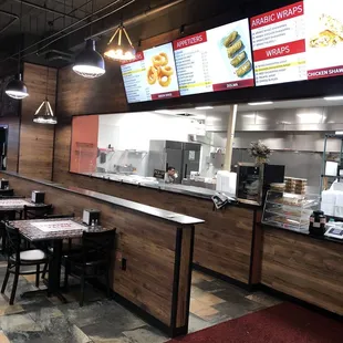 Counter where you order and pay.  Various menu items displayed.  Wide selection.