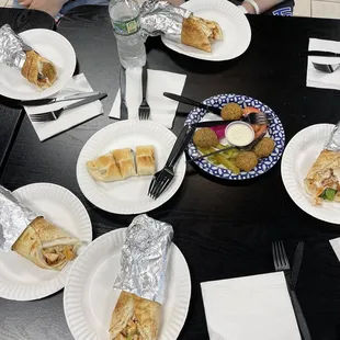 a group of people sitting around a table