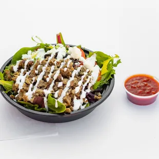 Combination of beef &amp; lamb cooked and chopped to perfection. Served served on a bed of basmati rice, spring mix &amp; our signature white sauce