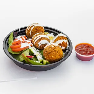 Chickpeas, onions, garlic, parsley, cilantro &amp; fava beans all in a ball shaped patty. Served on a bed of basmati rice &amp; spring mix.