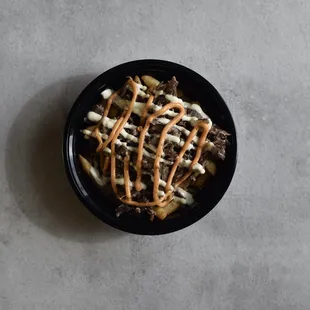 a bowl of fries with ketchup