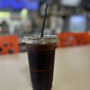 a cold beverage in a plastic cup