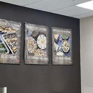 three posters on a wall