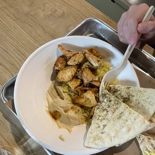 Two tablespoons of hummus, one half cup rice, eight pieces of chicken, three wedges of pita (not even a whole one! Lol)