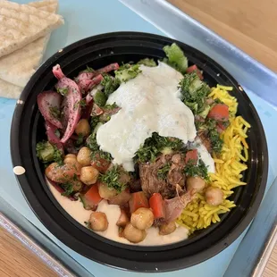 a bowl of food on a tray