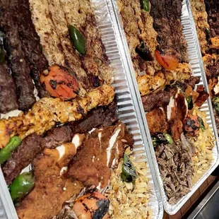 Tray for 8 people (only meats in the picture) comes with 2 rice, 3 stew, 1 soup, bread, garnishes, and Free Whole Grilled Chicken!