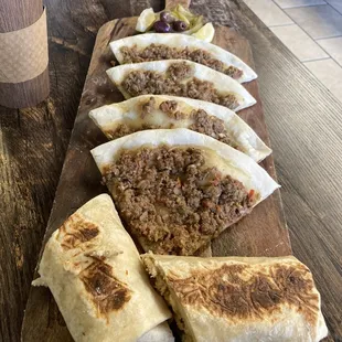 a variety of wraps on a cutting board