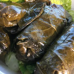 a plate of stuffed grape leaves