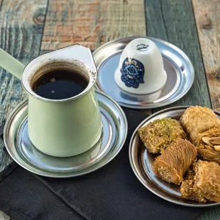 a cup of coffee and a plate of food