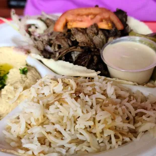 a plate of food with rice and vegetables