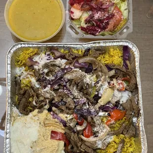 Take out Lamb Shawarma Plate -- comes with soup or salad. Loaded with rice underneath and a dolmada. Lots of very flavorful lamb on top.