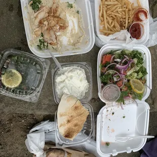 Chicken Shawarma with Baba Ganouj, French Fries, Fattoush Salad, Garlic Spread, Tabbouleh Salad, and Chicken Cream Chop Sandwich