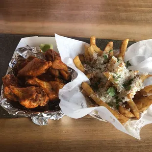 Side of Parmesan fries and 8 buffalo mild wings
