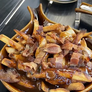 Poutine was awesome.  They had no problem making the fries extra crispy.  Bacon went well with the gravy and cheese curds.