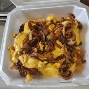 cheese and onions in a styrofoam container